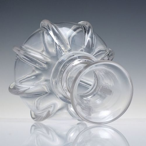 fig 1. A clear glass wine carafe featuring a bulbous body with vertical pillar moulding, applied neck rings, and a flared rim.