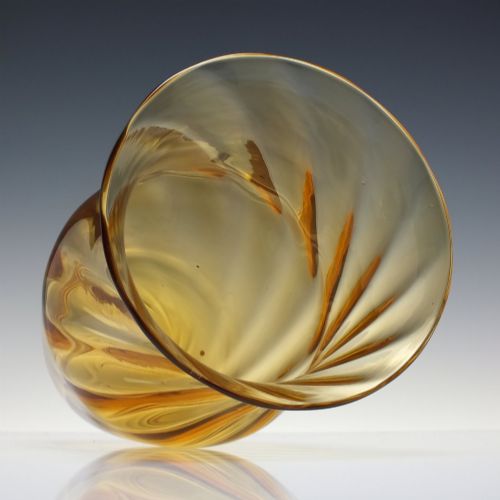 fig 2. An amber crystal vase featuring a twisted optical swirl pattern and a flared rim.