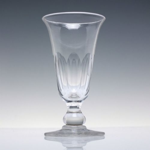 fig 2. A pair of clear cut-glass Georgian jelly glasses featuring flared rims, panel-cut lower bowls, short knopped stems, and circular flat bases.