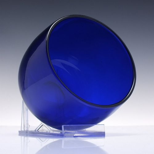 fig 1. A Victorian cobalt blue glass finger bowl featuring a rounded cylindrical form and a smooth rim.