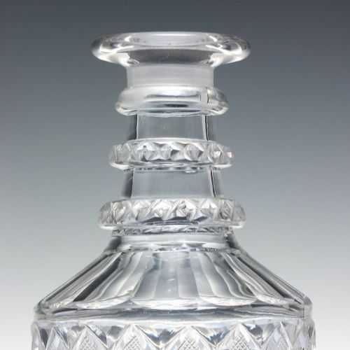 fig 3. A pair of clear cut lead crystal Georgian decanters featuring diamond cut bands, neck rings, and mushroom stoppers.