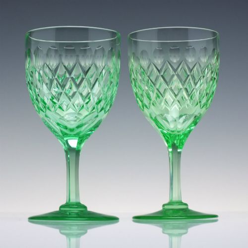 fig 2. A set of six Victorian light green vaseline glass wine goblets featuring diamond-cut bowls and faceted stems.