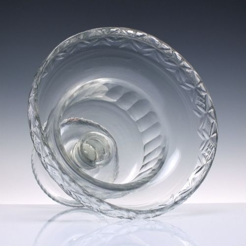 fig 2. A clear Georgian cut glass standing bowl featuring a wide diamond-cut rim, fluted basin, knopped stem, and circular foot.