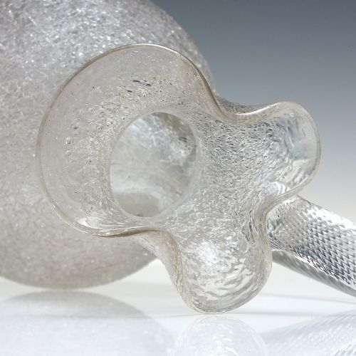 fig 3. A late 19th-century Victorian clear overshot glass champagne jug with a textured ice-glass surface, flared spout, and an applied ribbed clear handle.