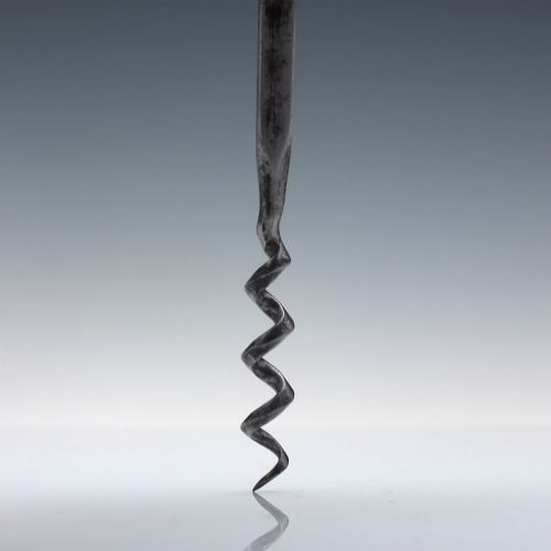 fig 2. A Victorian direct-pull corkscrew featuring a T-bar handle made of dark polished horn capped with silver-plated ends and a steel helix worm.