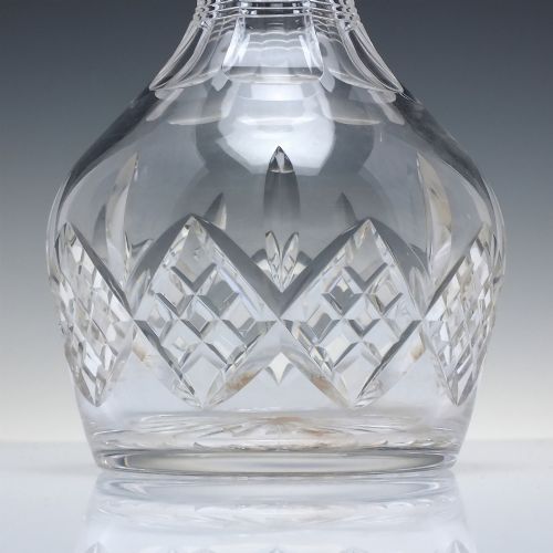 fig 2. A clear cut lead crystal spirit decanter featuring a geometric diamond-cut lower body and a matching faceted glass stopper.