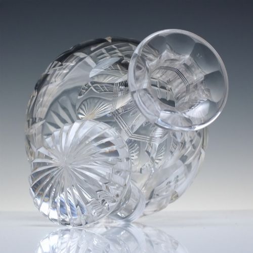 fig 3. A clear cut lead crystal spirit decanter featuring a geometric diamond-cut lower body and a matching faceted glass stopper.
