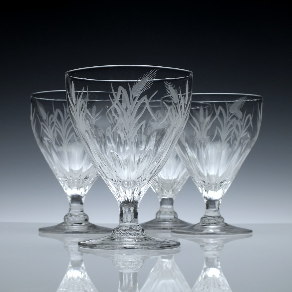 A Set of Four Engraved 19th Century Petal Moulded Glass Rummers c1800