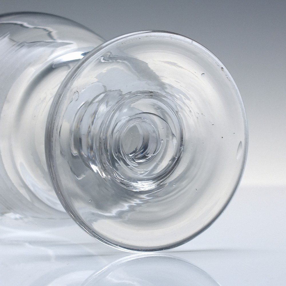 A clear 19th-century glass rummer featuring detailed wheel-engraved Masonic symbols, a knopped stem, and a flat circular base. View VI
