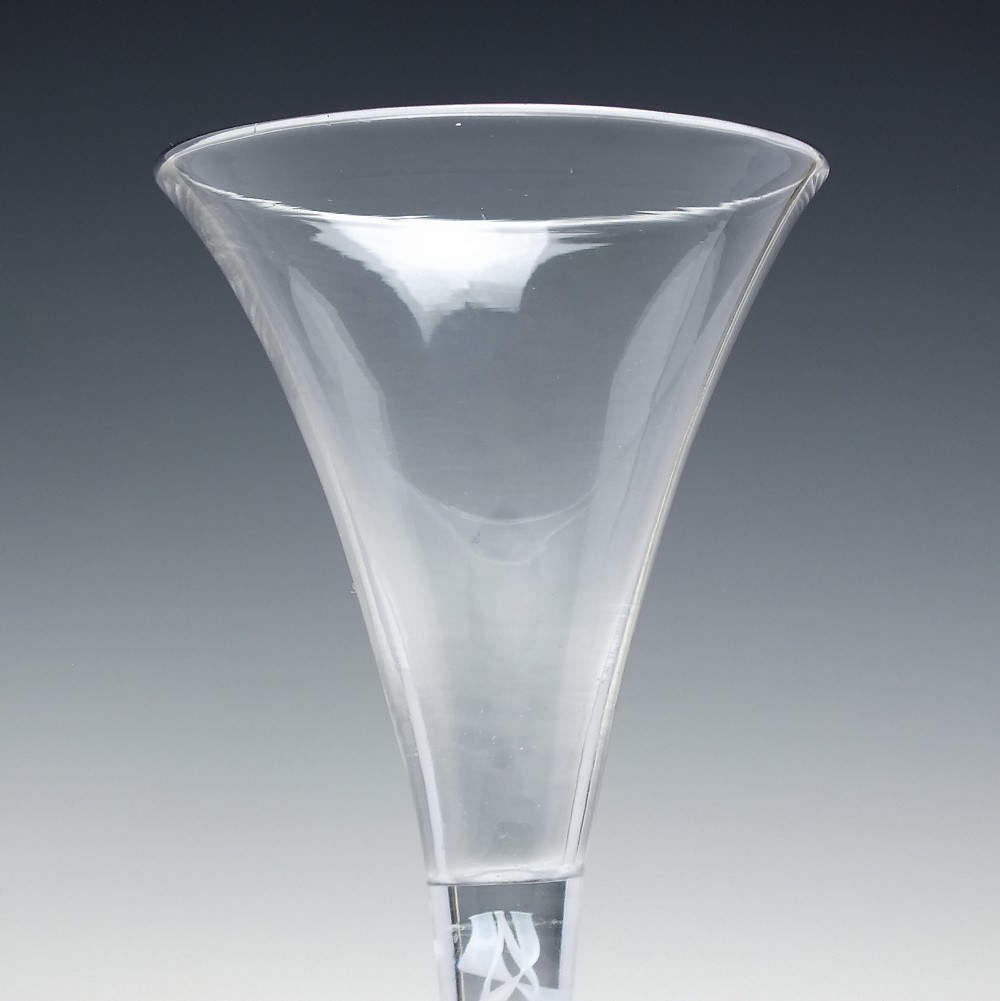 A Georgian wine glass featuring a clear trumpet-shaped bowl resting on a straight stem with an internal white opaque double series twist spiral and a conical foot. View IV