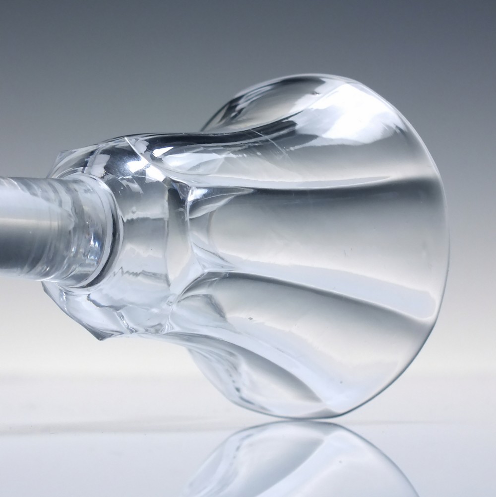 An 18th-century clear lead glass wine goblet featuring an inverted petal moulded bowl, a tall plain stem, and a circular foot. View V