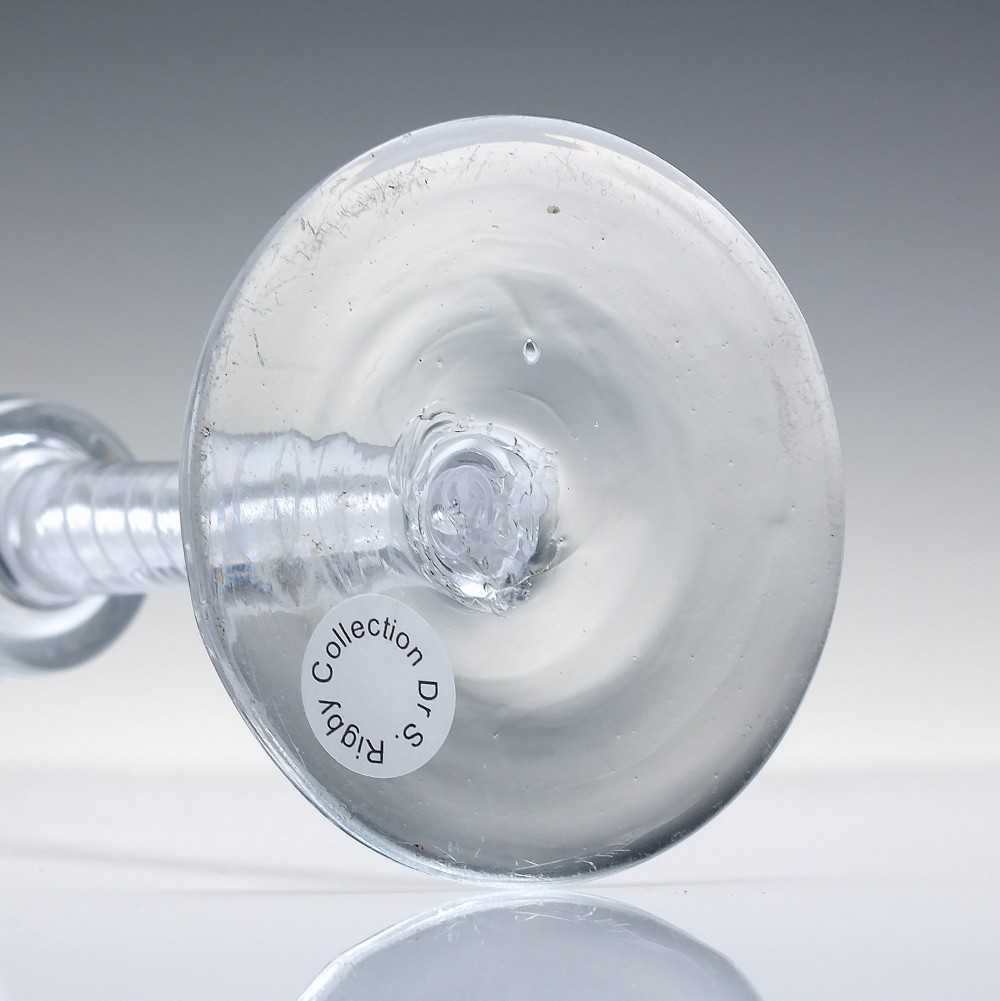 An eighteenth-century clear lead glass wine glass featuring a flared bucket bowl and a mixed twist stem on a conical foot. View VI