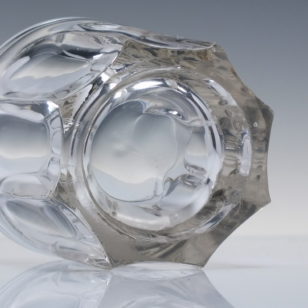 A clear Victorian glass whisky tumbler featuring fluted arch cuttings around the lower body and a thick base. View III