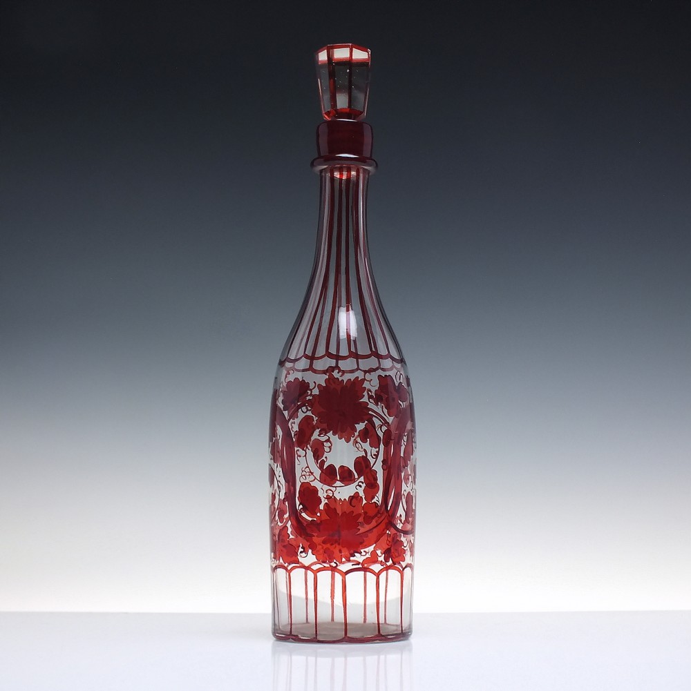 A tall clear glass decanter featuring red hand-painted floral motifs, vertical stripes, and a faceted glass stopper. View II