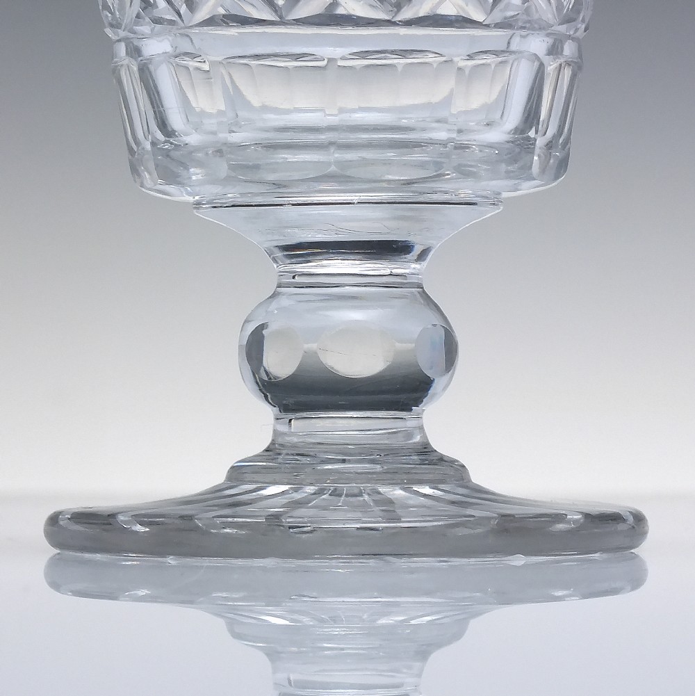 A clear Georgian cut lead crystal glass rummer featuring diamond-patterned facets and a knopped stem. View IV