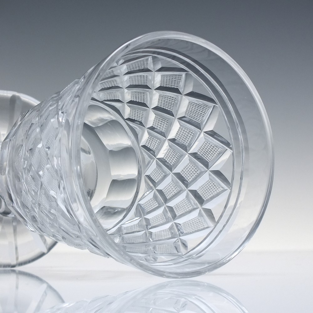 A clear Georgian cut lead crystal glass rummer featuring diamond-patterned facets and a knopped stem. View V