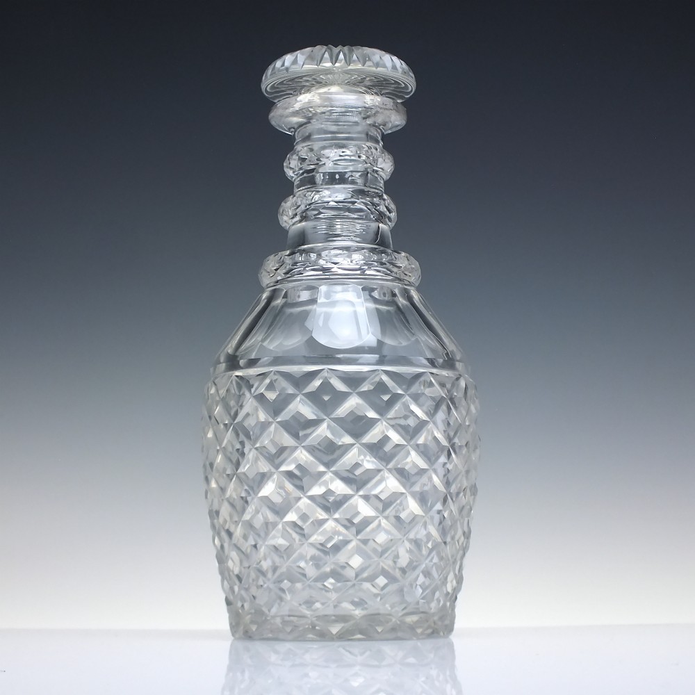 A clear Victorian cut glass wine decanter featuring a diamond-patterned lower body, ringed neck, and a matching faceted stopper. View II