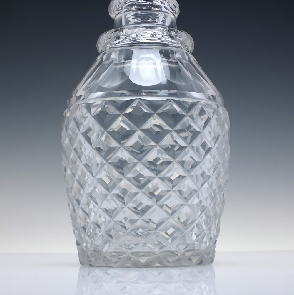 A clear Victorian cut glass wine decanter featuring a diamond-patterned lower body, ringed neck, and a matching faceted stopper. View III
