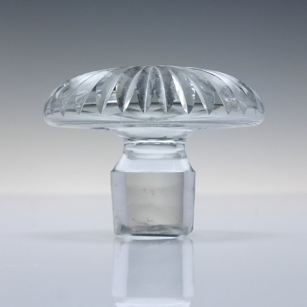 A clear Victorian cut glass wine decanter featuring a diamond-patterned lower body, ringed neck, and a matching faceted stopper. View VII