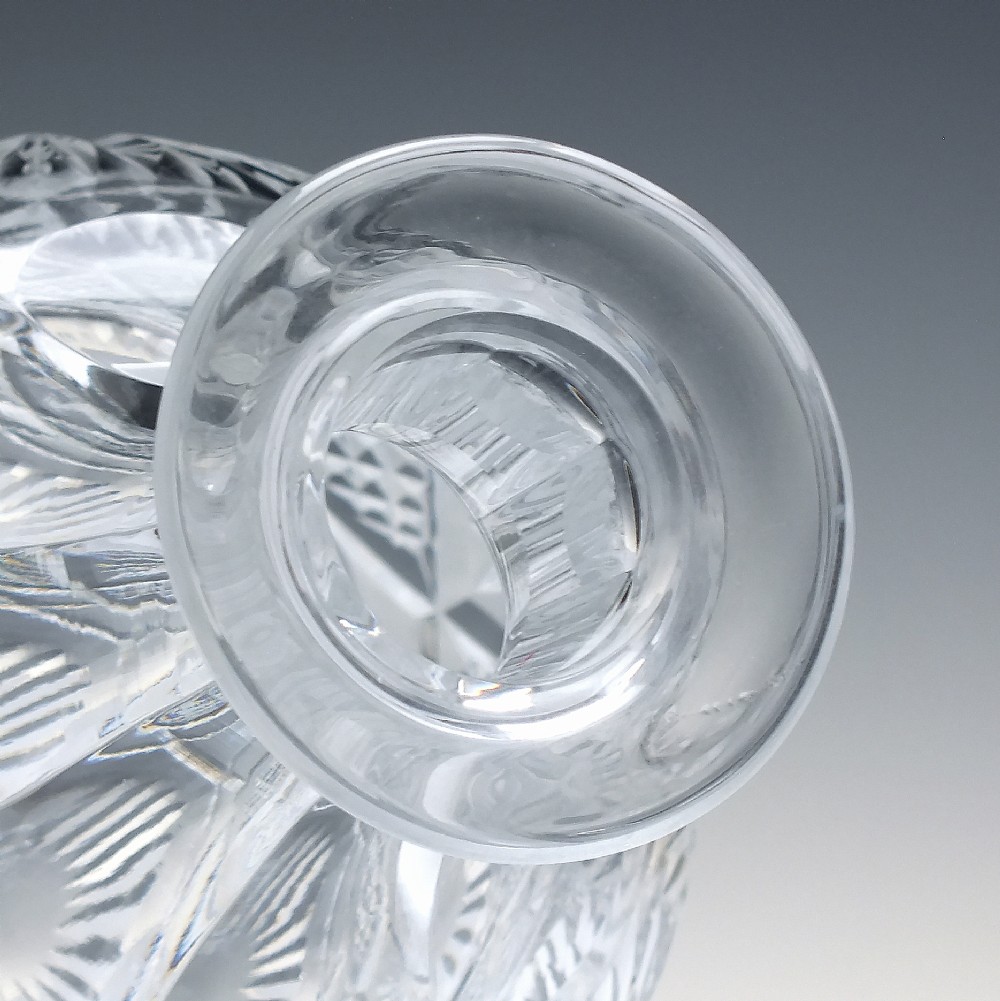 A clear cut lead crystal spirit decanter with starburst patterning and a fitted flat-topped glass stopper. View IV