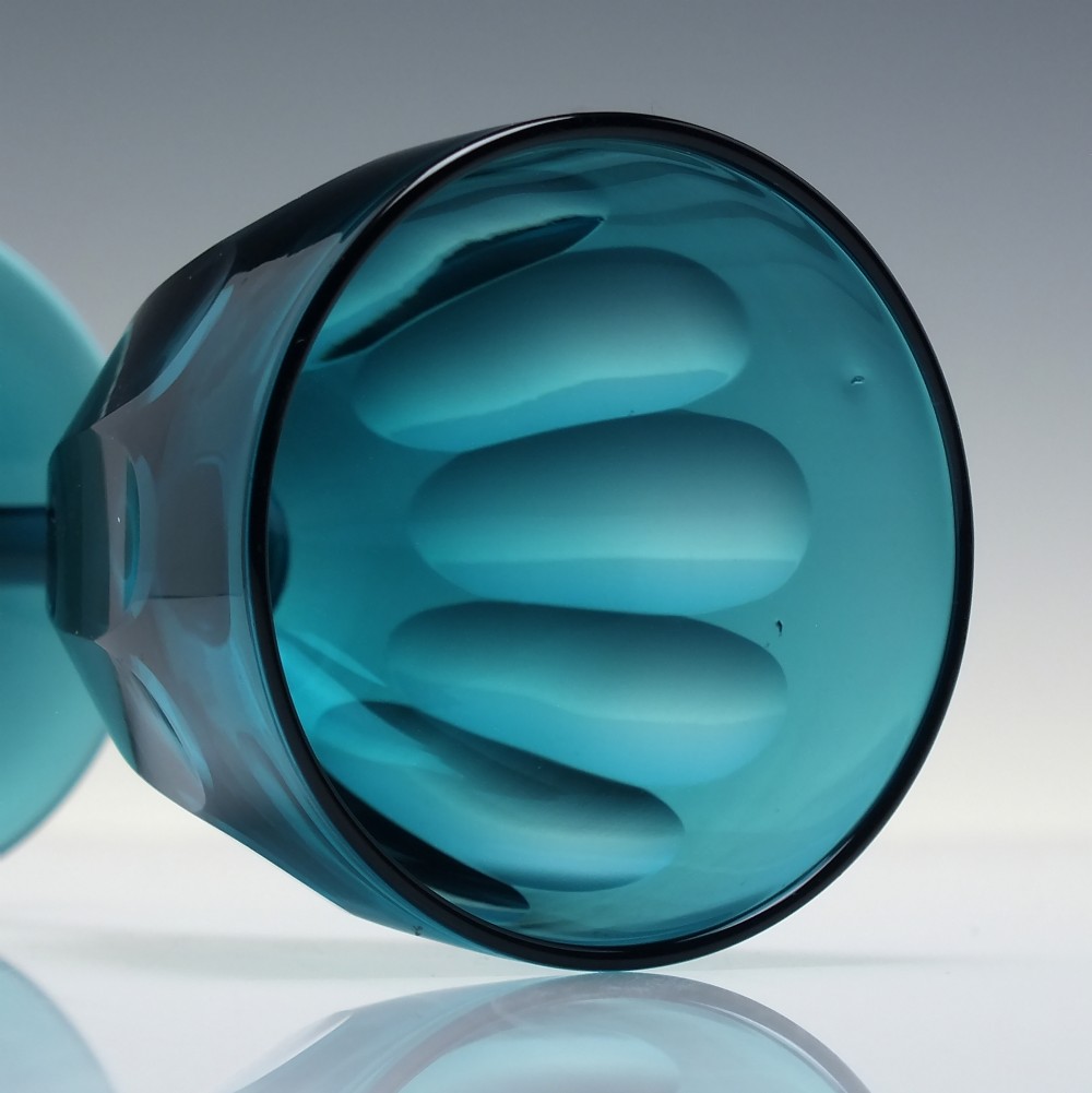A Victorian peacock blue glass wine goblet featuring a panelled bowl, plain stem, and circular base. View IV