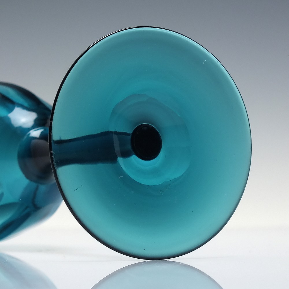 A Victorian peacock blue glass wine goblet featuring a panelled bowl, plain stem, and circular base. View V