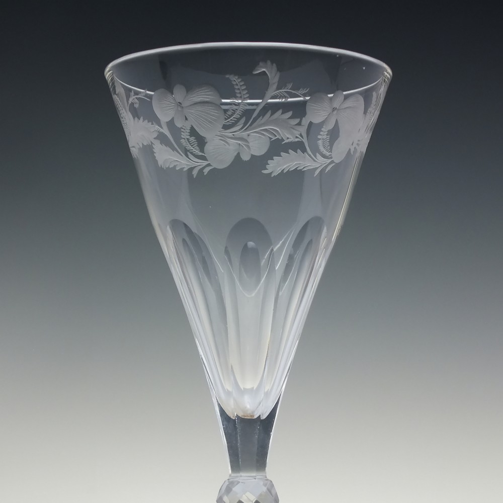 A clear 19th-century Victorian glass goblet with wheel-engraved floral motifs around the upper rim and facet cutting on the lower bowl and knopped stem. View III