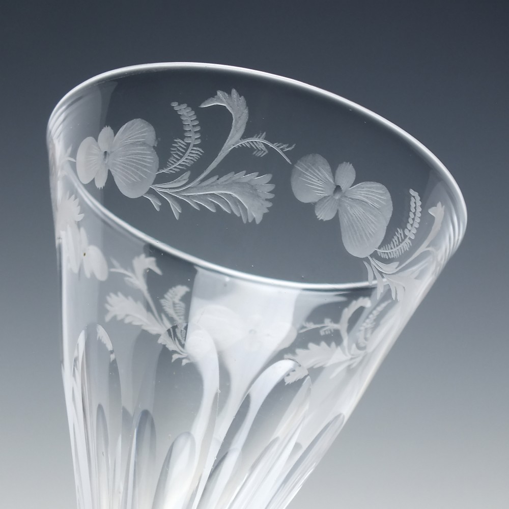 A clear 19th-century Victorian glass goblet with wheel-engraved floral motifs around the upper rim and facet cutting on the lower bowl and knopped stem. View IV