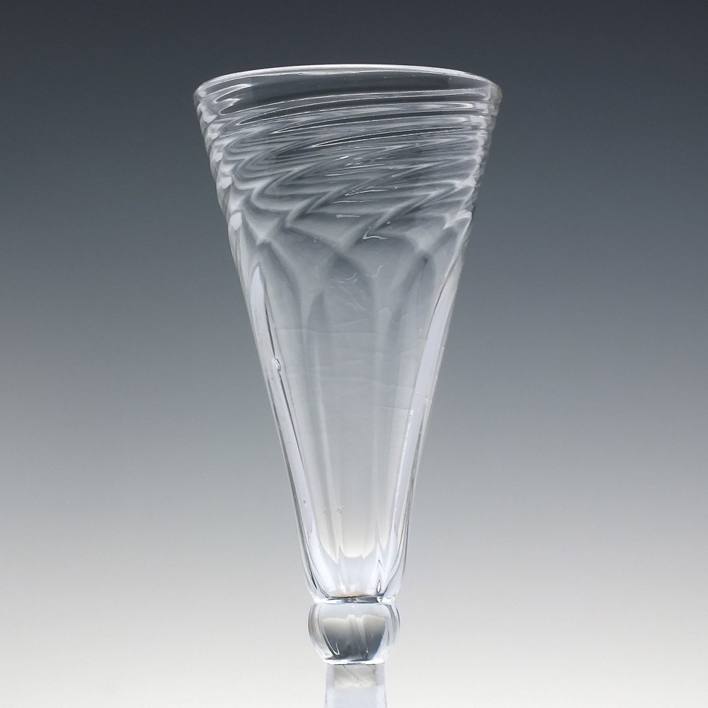 An eighteenth-century clear glass ale goblet featuring spiral wrythen moulding on a conical bowl supported by a knopped stem and circular foot. View III