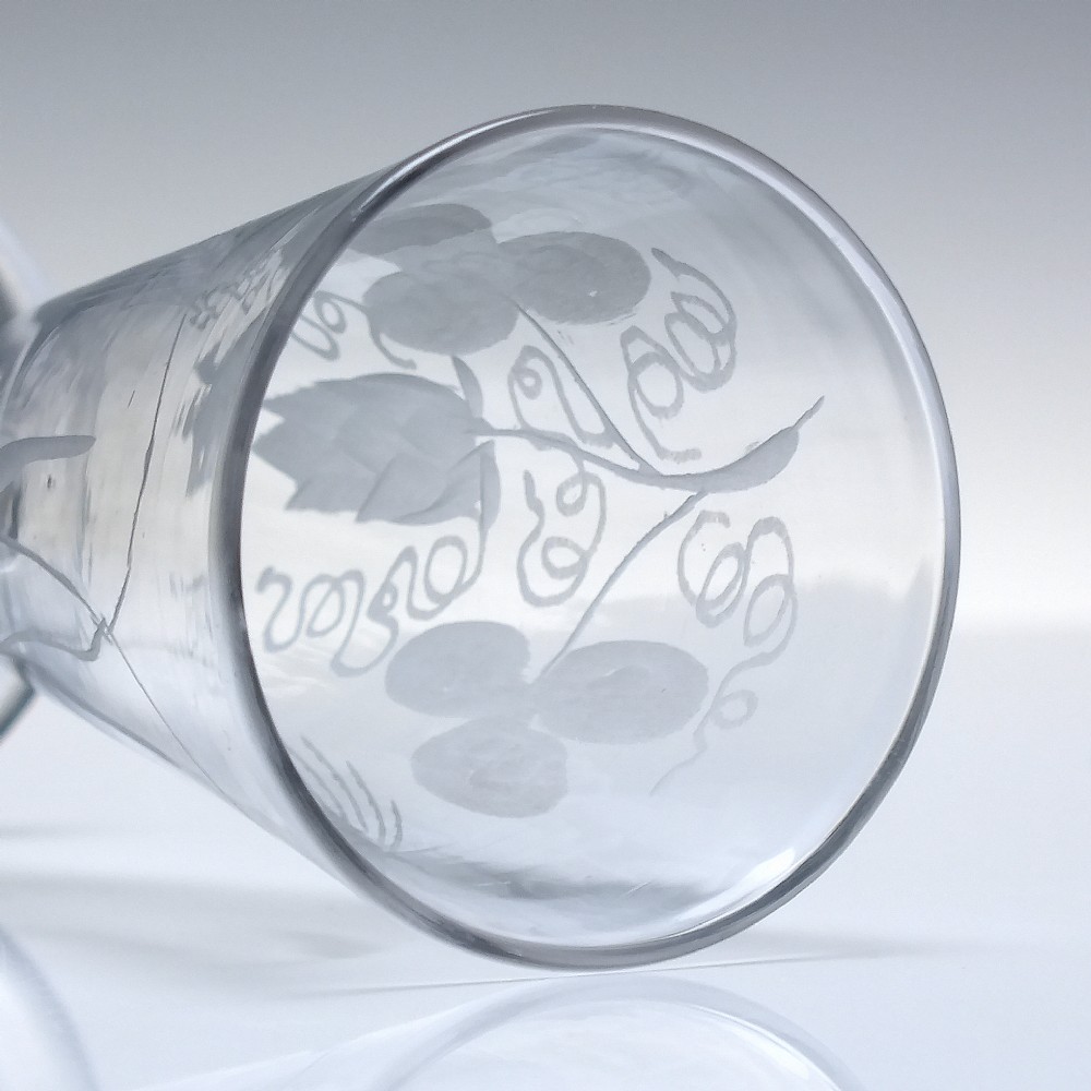Pair of clear Georgian lead glass ale flutes featuring wheel-engraved barley and hops decoration on knopped stems. View VI
