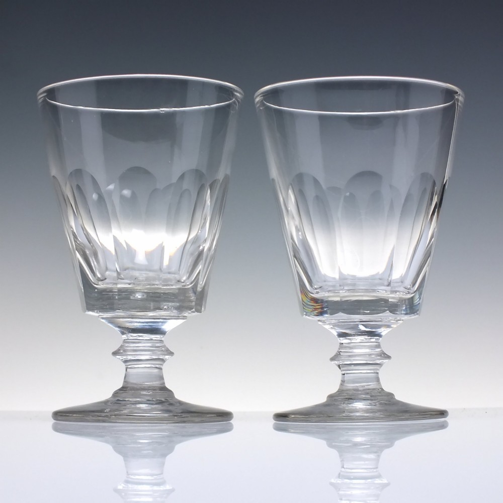 A pair of clear Victorian glass rummers with slice-cut bowls on short knopped stems and flat round feet. View II