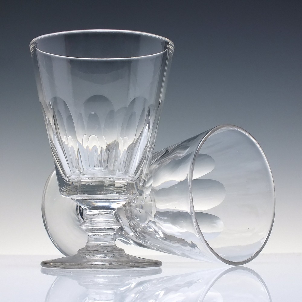 A pair of clear Victorian glass rummers with slice-cut bowls on short knopped stems and flat round feet. View III