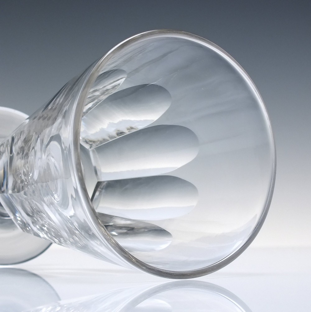 A pair of clear Victorian glass rummers with slice-cut bowls on short knopped stems and flat round feet. View IV