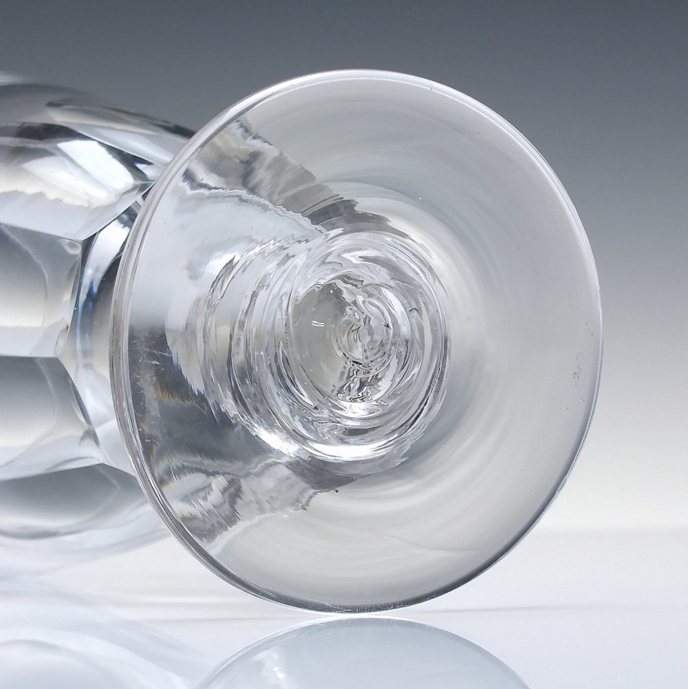 A pair of clear Victorian glass rummers with slice-cut bowls on short knopped stems and flat round feet. View V
