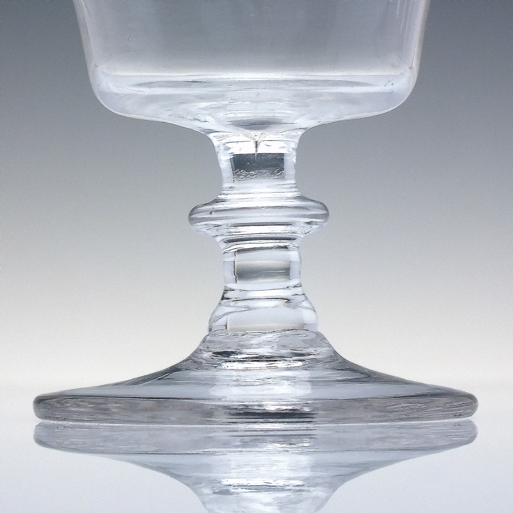 A clear Georgian glass rummer with a cup-shaped bowl wheel-engraved with hop and barley motifs, set on a short knopped stem and flat circular base. View III