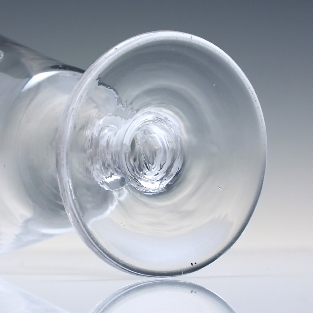 A clear Georgian glass rummer with a cup-shaped bowl wheel-engraved with hop and barley motifs, set on a short knopped stem and flat circular base. View VII