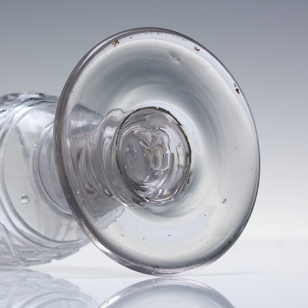 A pair of early 19th-century clear cut lead crystal dram glasses featuring diamond cutting and knopped stems. View IV