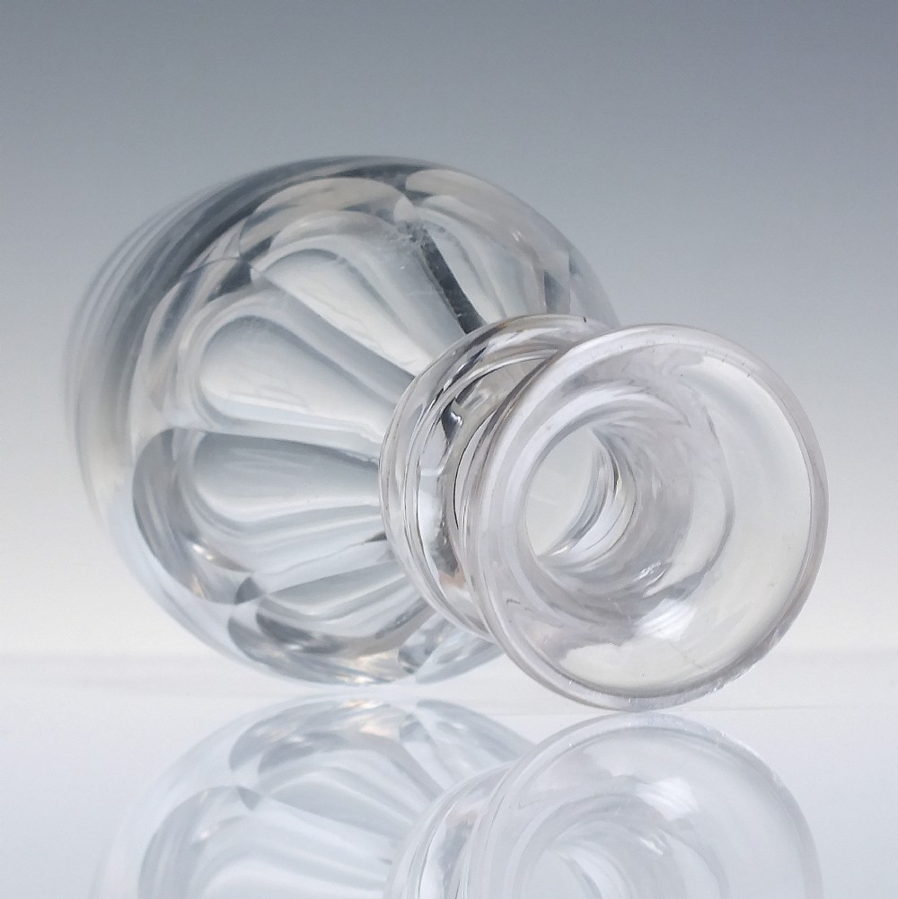A clear hand-blown glass Scottish whisky measure featuring a flared rim, applied neck ring, and cut shoulder flutes. View III