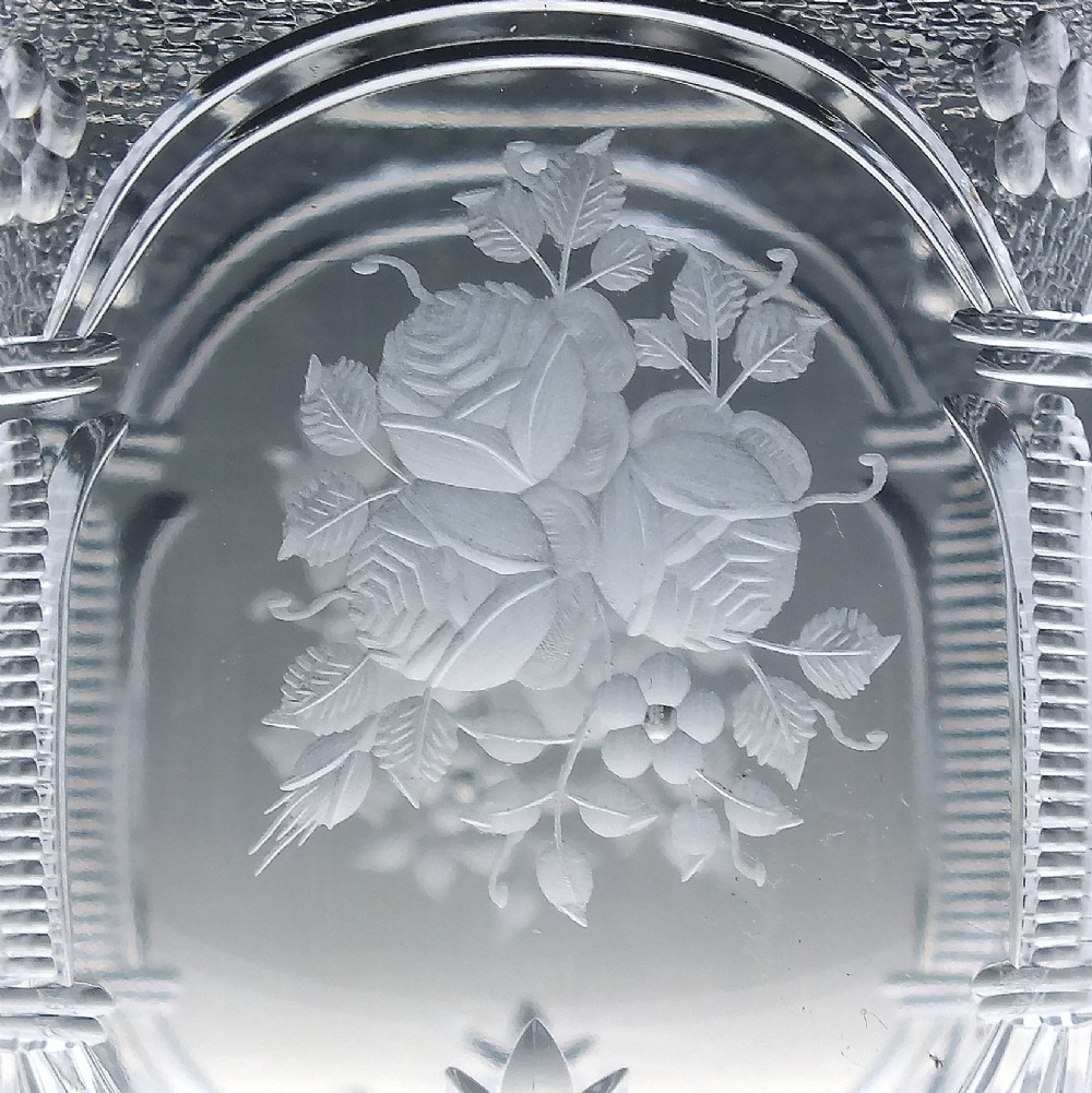 A set of six clear lead crystal wine glasses featuring intricate acid-etched floral panels and textured facet-cut stems. View VI