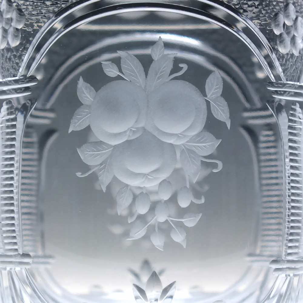A set of six clear lead crystal wine glasses featuring intricate acid-etched floral panels and textured facet-cut stems. View VII