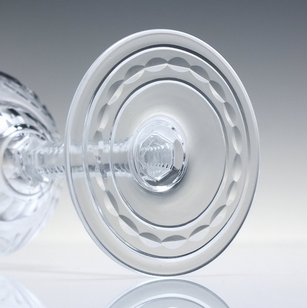 A set of six clear lead crystal wine glasses featuring intricate acid-etched floral panels and textured facet-cut stems. View XI