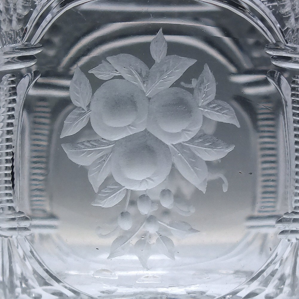 A set of six clear lead crystal dram glasses featuring acid-etched floral panels set within archways and faceted diamond-cut stems. View VIII