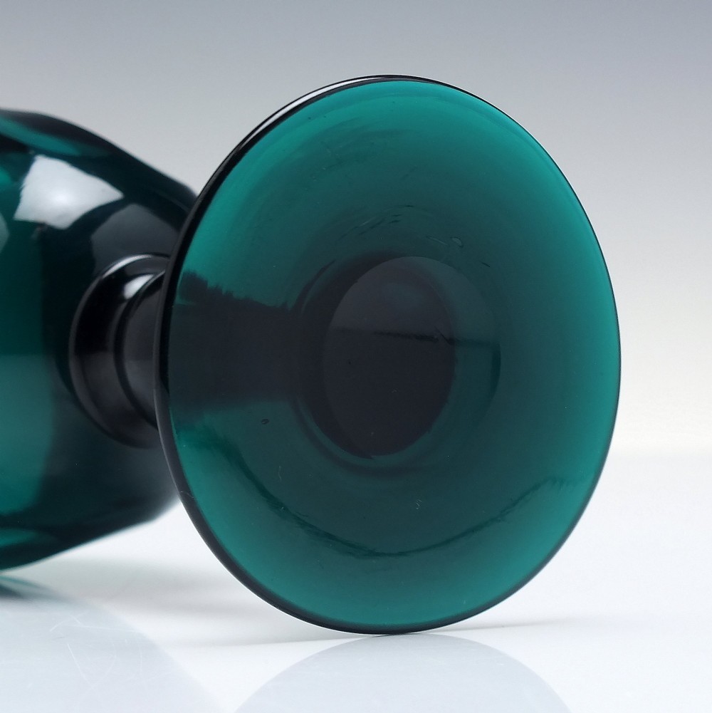 An early 19th-century turquoise green glass wine goblet featuring a cut bowl and a knopped stem on a flat circular base. View V