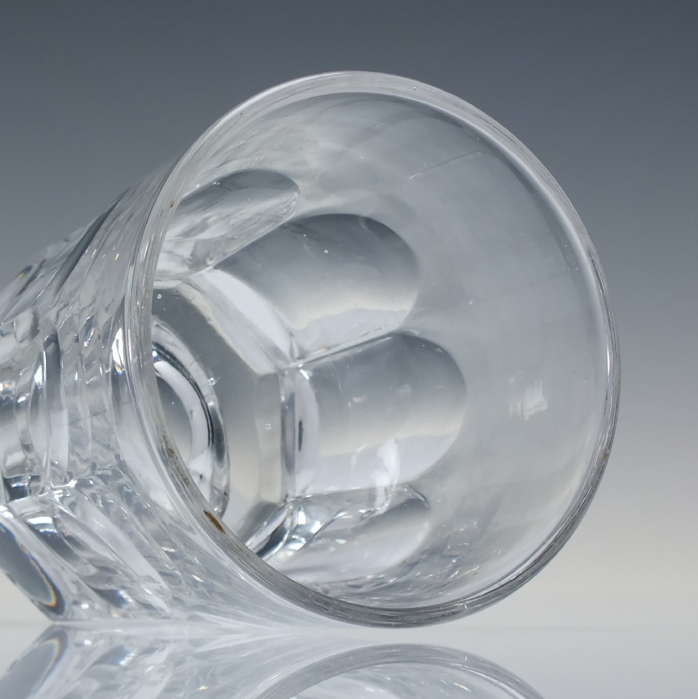A clear mid-19th-century Victorian glass whisky tumbler featuring fluted panels around the lower body and a thick base. View II