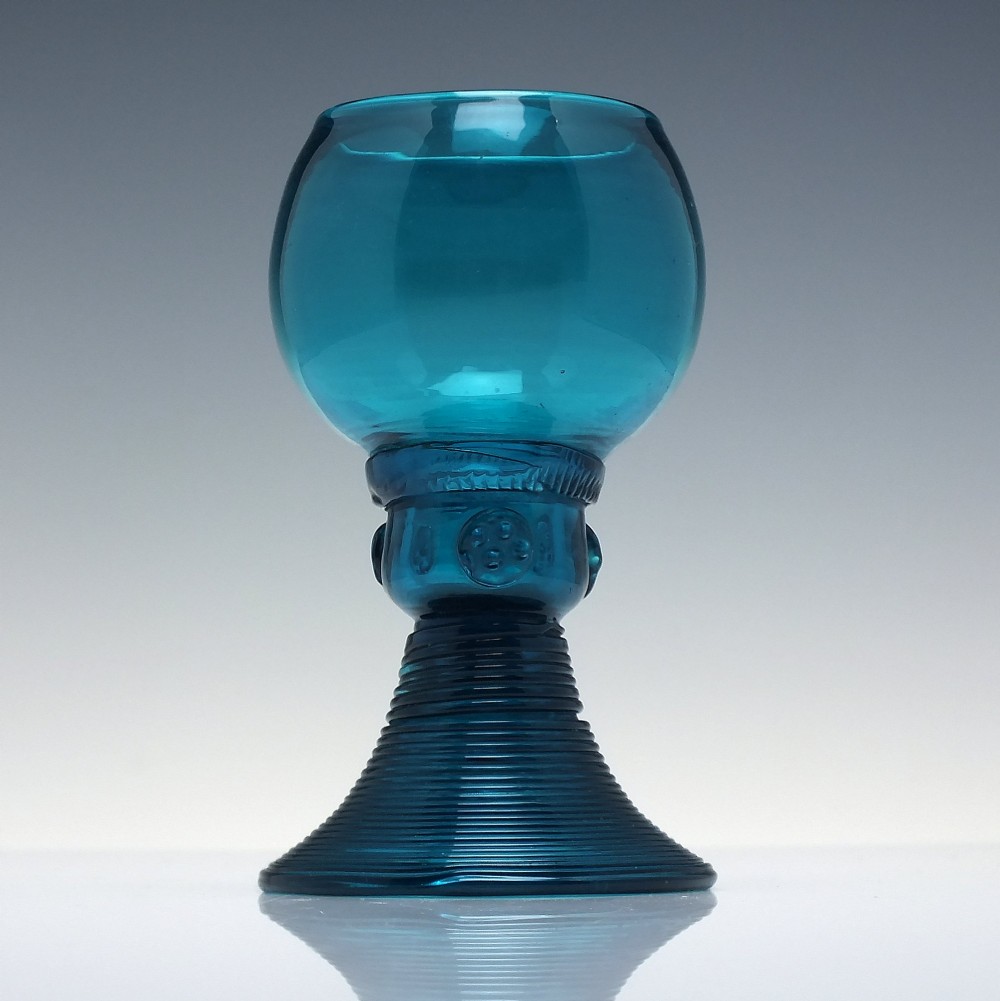 A pair of early 19th-century peacock blue glass roemers with globular bowls, prunted stems, and broad coiled pedestals. View III
