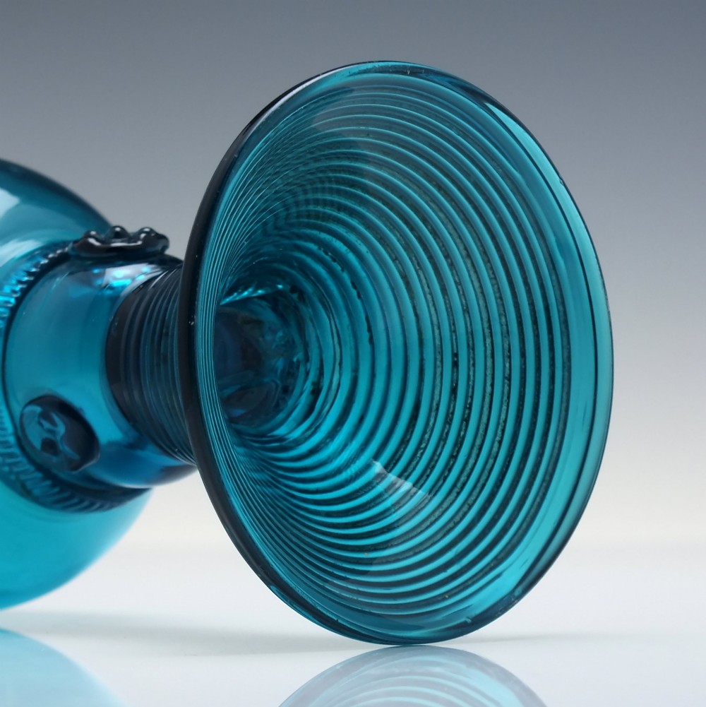 A pair of early 19th-century peacock blue glass roemers with globular bowls, prunted stems, and broad coiled pedestals. View VII
