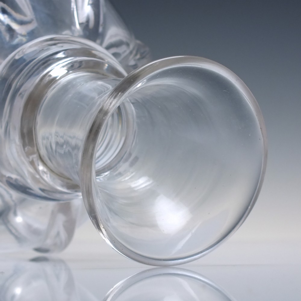 A clear glass wine carafe featuring a bulbous body with vertical pillar moulding, applied neck rings, and a flared rim. View III