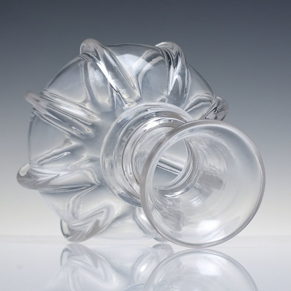 A clear glass wine carafe featuring a bulbous body with vertical pillar moulding, applied neck rings, and a flared rim. View II