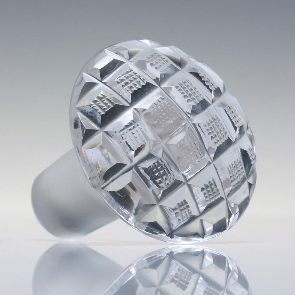 A pair of clear cut lead crystal Georgian decanters featuring diamond cut bands, neck rings, and mushroom stoppers. View VII