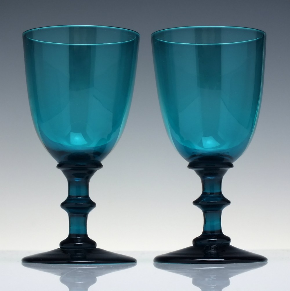 A pair of Georgian teal blue hand-blown glass wine goblets featuring knopped stems and circular bases. View II